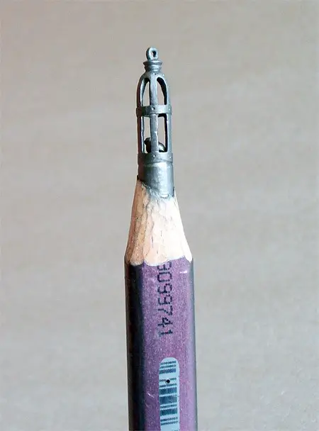 micro art bird carving on pencil