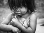 Little Guarani Girl Holds A Dead Rat Tight