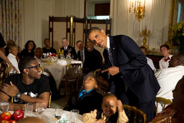 Obama and this snoozing kid picture during an event