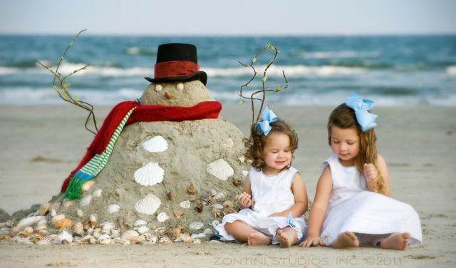 Sand snowman on beach photo for Christmas cards