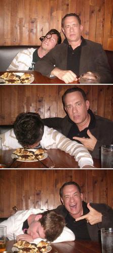 Tom Hanks snapping pics with dude in a restaurant