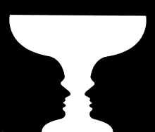 Two faces looking at each other or a vase optical illusion