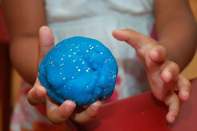 Use A Ball Of Play Dough To Clean Up Spilled Powders
