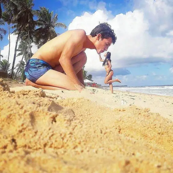 Funny forced perspective photos with friends on beach