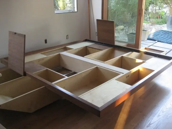 Base of a bed made up of drawers and storage spaces 