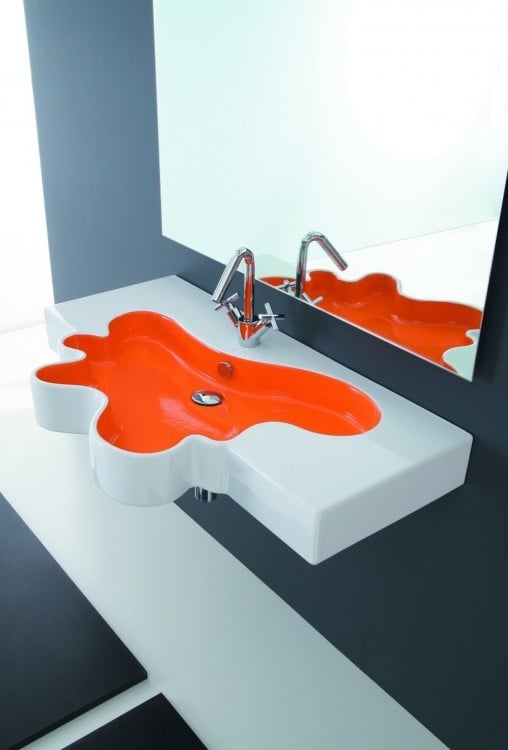 Bathroom sink at its base an orange stain 