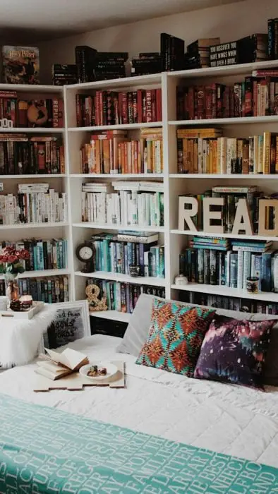 Bookshelf at the head of a bed
