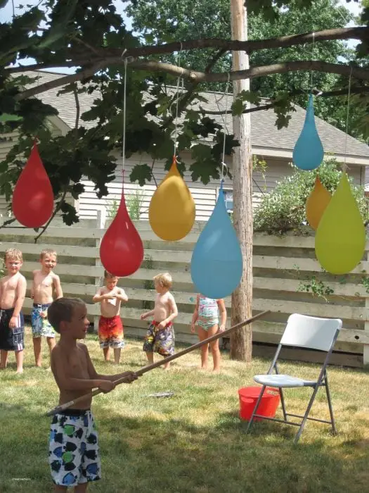 Children Playing Water-Filled Balloon Piñatas