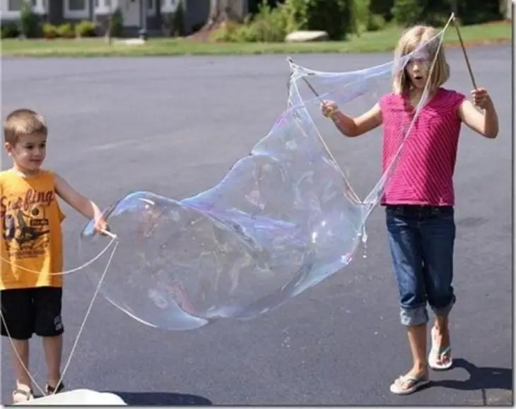 Children Playing with Giant Bubbles