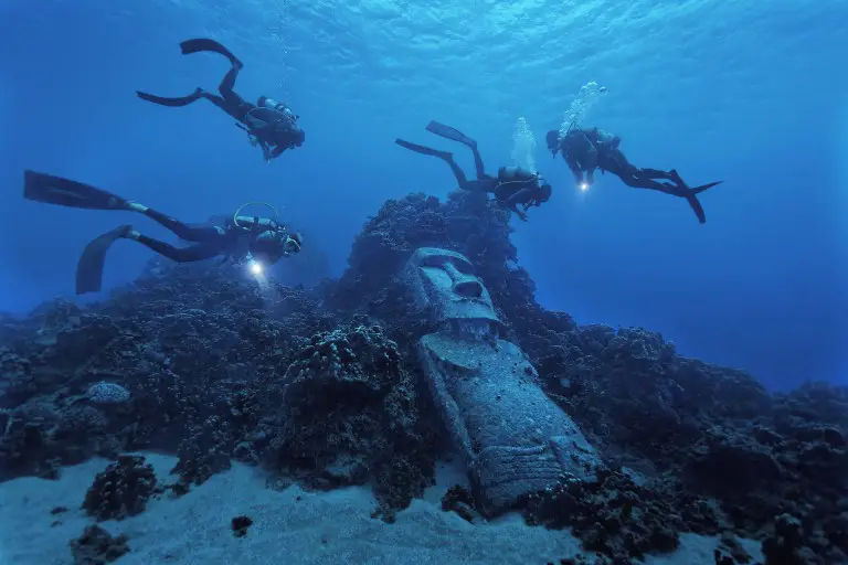 Divers Lifting The Sculptures In The Bahamas