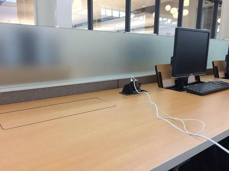 Desktop that hides the computer for more space