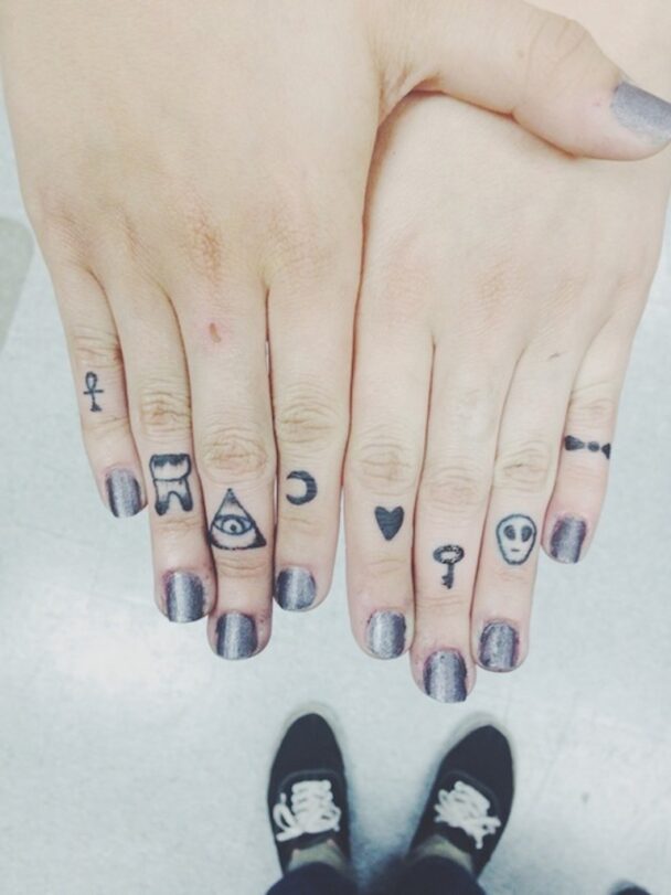 Fingers Tattoo Of Different Symbols