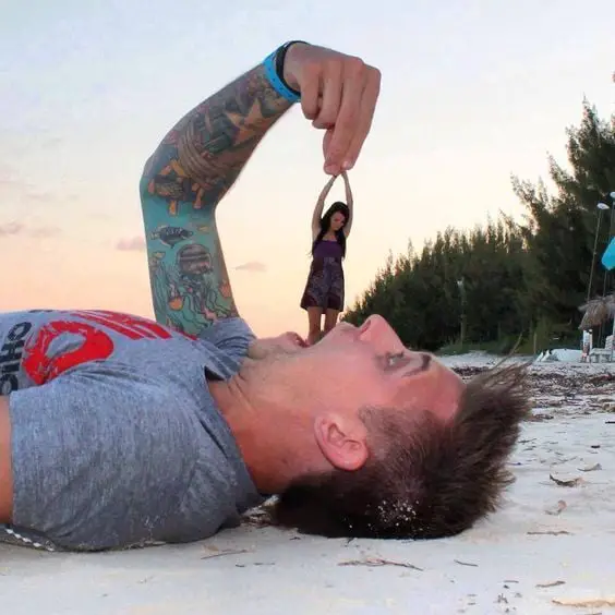 Funny forced perspective photos with friends on beach