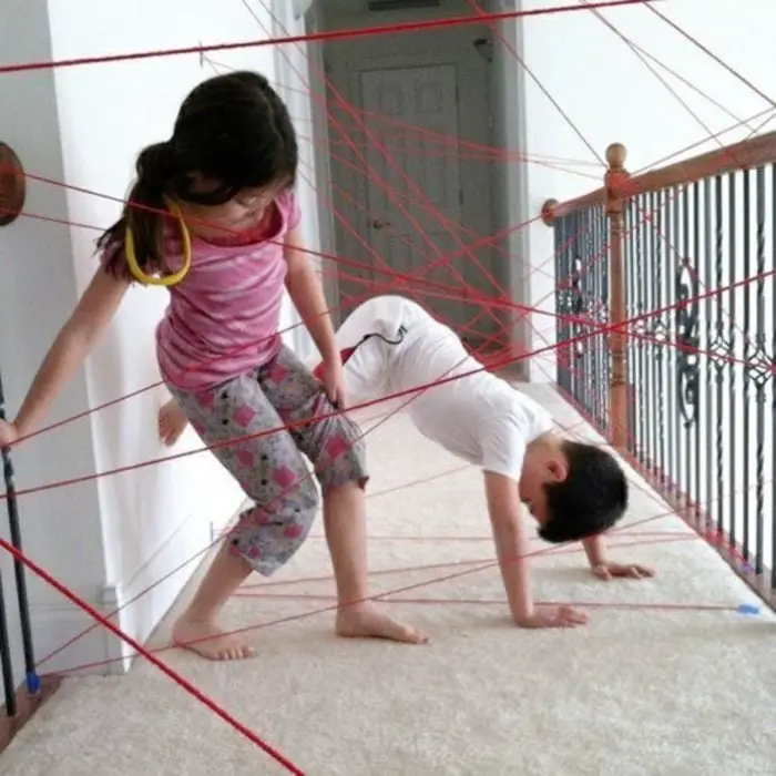 Kids Playing in Yarn Laser Trap