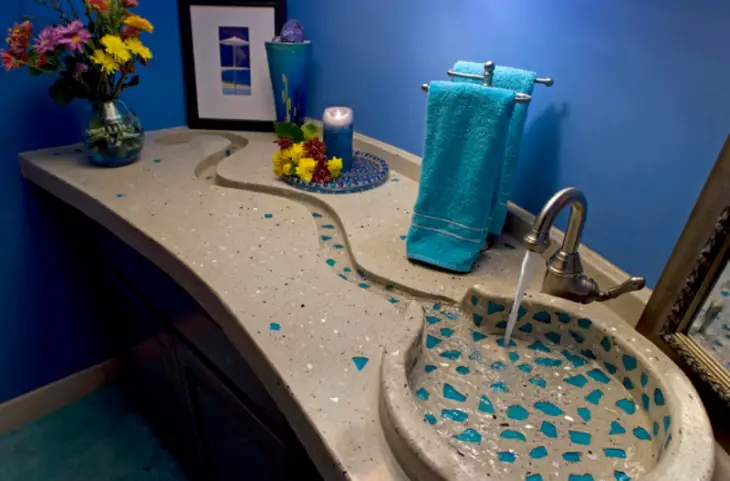 Marble bathroom sink with small stones in blue color 