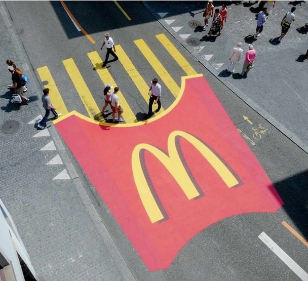 McDonald's advertisement on the pavement of a street 