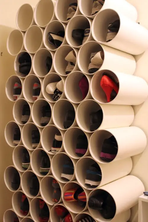 PVC pipes fixed to the wall to accommodate shoes 