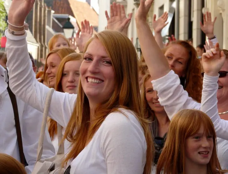 Redhead people waving 