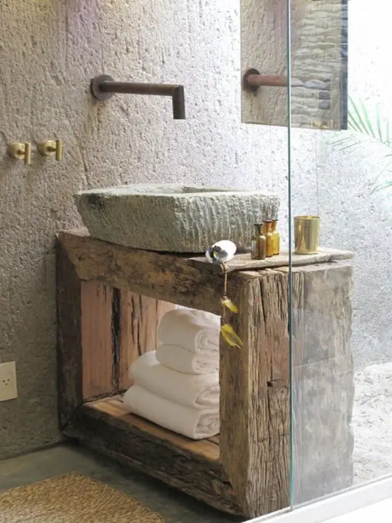 Rustic bathroom sink made of wood and stone 