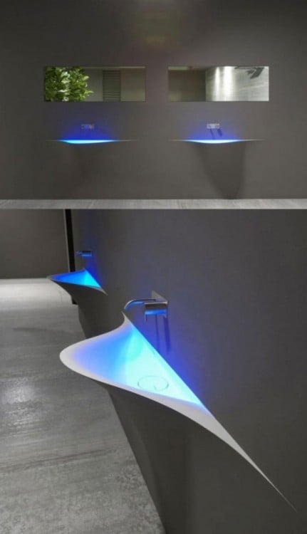 Sleek modern washbasin with blue lighting 