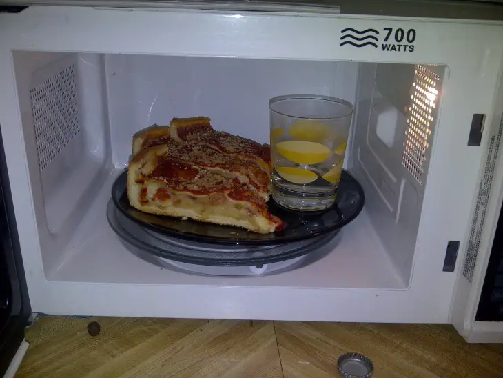 Trick To Keep Your Pizza From Going Hard In The Microwave