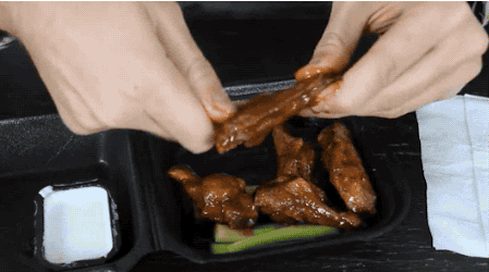Alt=gif Of A Person Removing The Bone From Their Chicken Wings