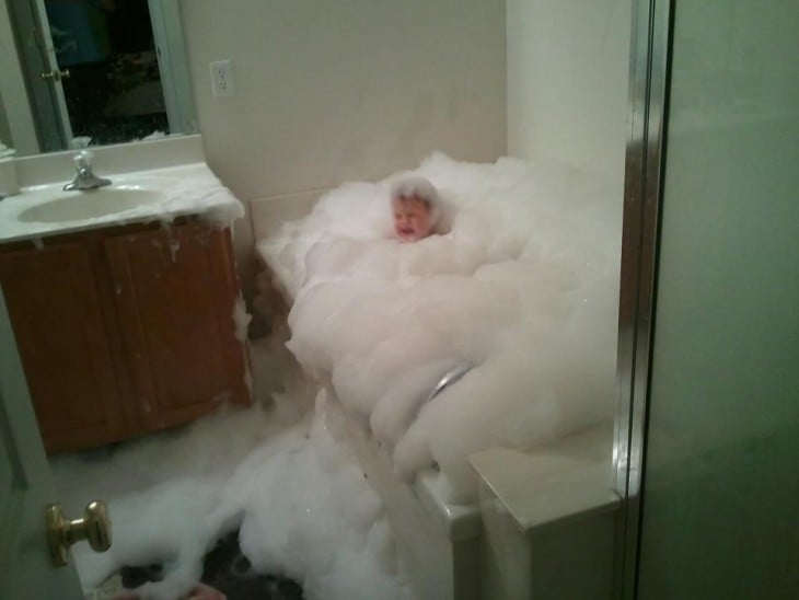 Baby crying inside a bathtub full of foam 