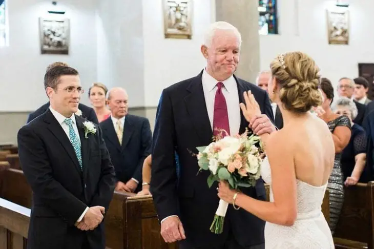 Bride Touches A Man's Chest 
