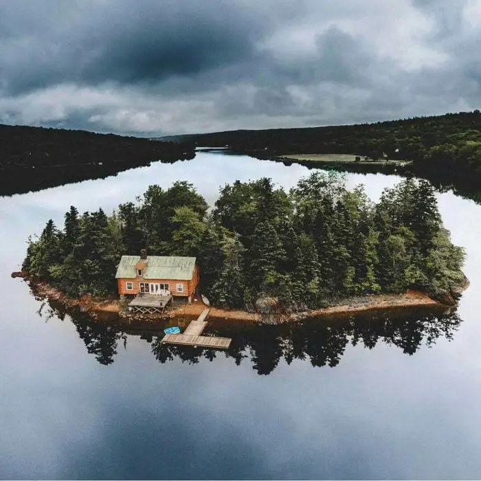 Cabin on an island in the middle of a lake