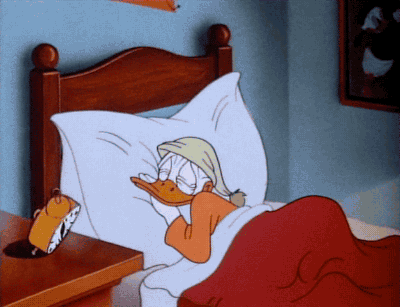 DONALD DUCK SLEEPING AND THE ALARM CLOCK RINGS