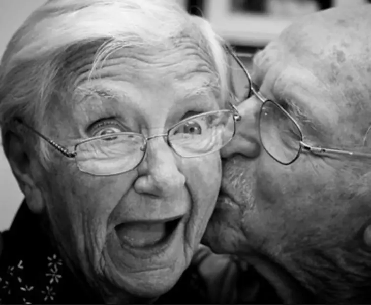 Elderly lady surprised by her husband