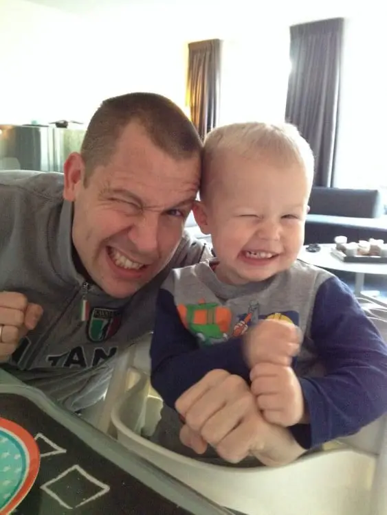 Father and son making the same face 