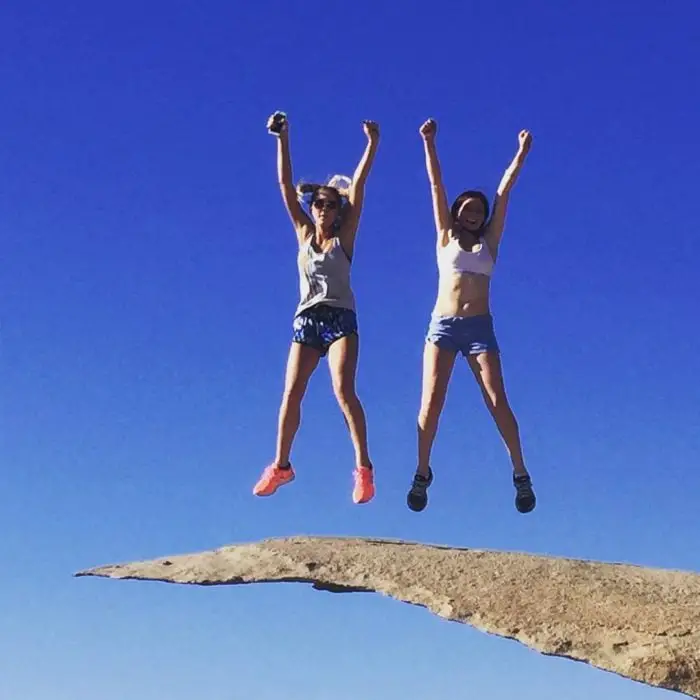 Girls jumping on potato chip rock
