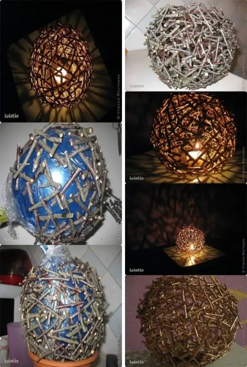 Lamp made of branches with a globe as a base 