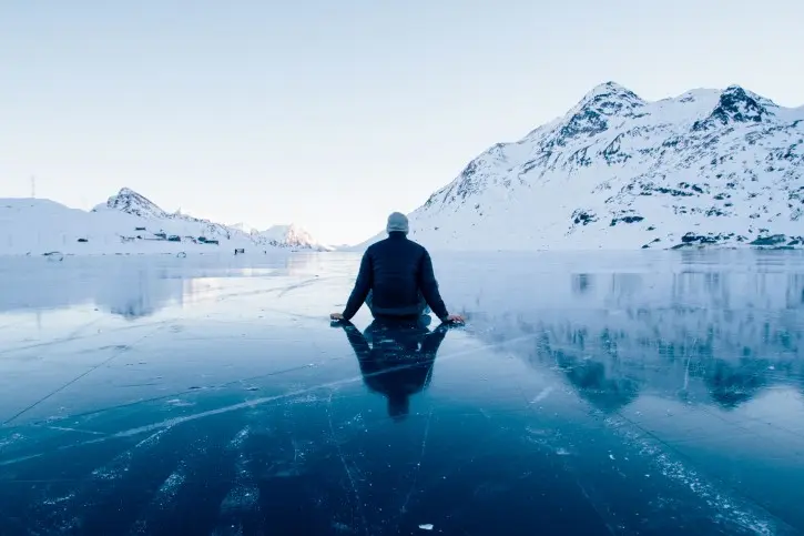 Lonely Person on Frozen Lake