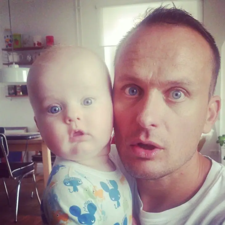 Lookalike father and son with the same face and eyes the same color 