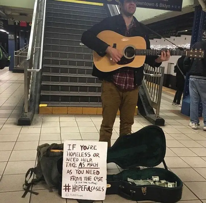 Man Plays Guitar To Raise Money 