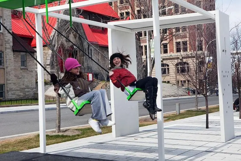 Bus stop with swings